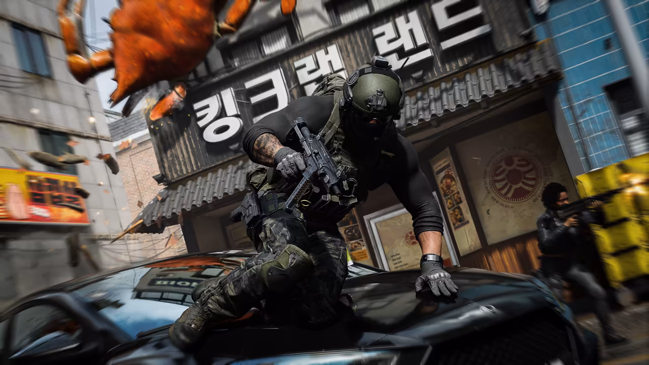A soldier in a helmet and gloves leaps over a black car's hood with a rifle; behind him a storefront carries large Korean letters, an orange crab figure tumbles from above and another armed figure stands at right.