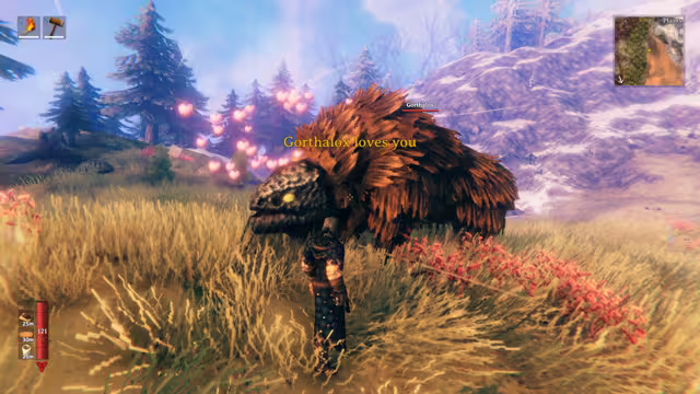 In-game screenshot of a shaggy brown Lox with pink hearts floating around it and the text 'Gorthalox loves you', next to an armored Viking in golden grass.