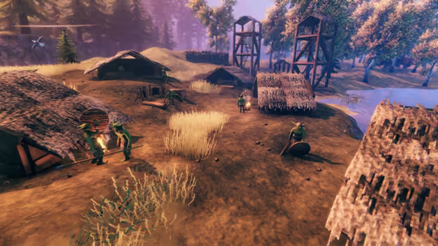An elevated view of a dirt clearing with low thatched huts, two tall wooden watchtowers and a palisade; small green goblin-like Fulings stand about, one with a torch, one with a spear, one with a round shield, beside tufts of tall pale grass.