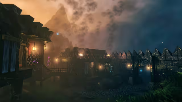 At dusk, dark stone buildings with stepped rooflines and blue drapes stand behind a wall topped with pointed spires, lit by small hanging lanterns, with a jagged mountain and drifting smoke behind