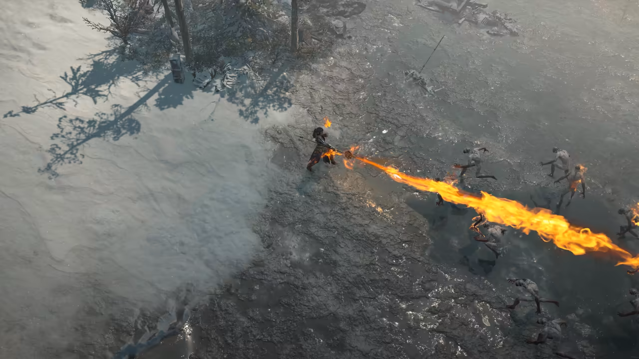 Top-down winter scene: snow at left, wet dark ground at right. A figure with a staff shoots a long roaring stream of orange flame across the frame into a crowd of pale, thin creatures.