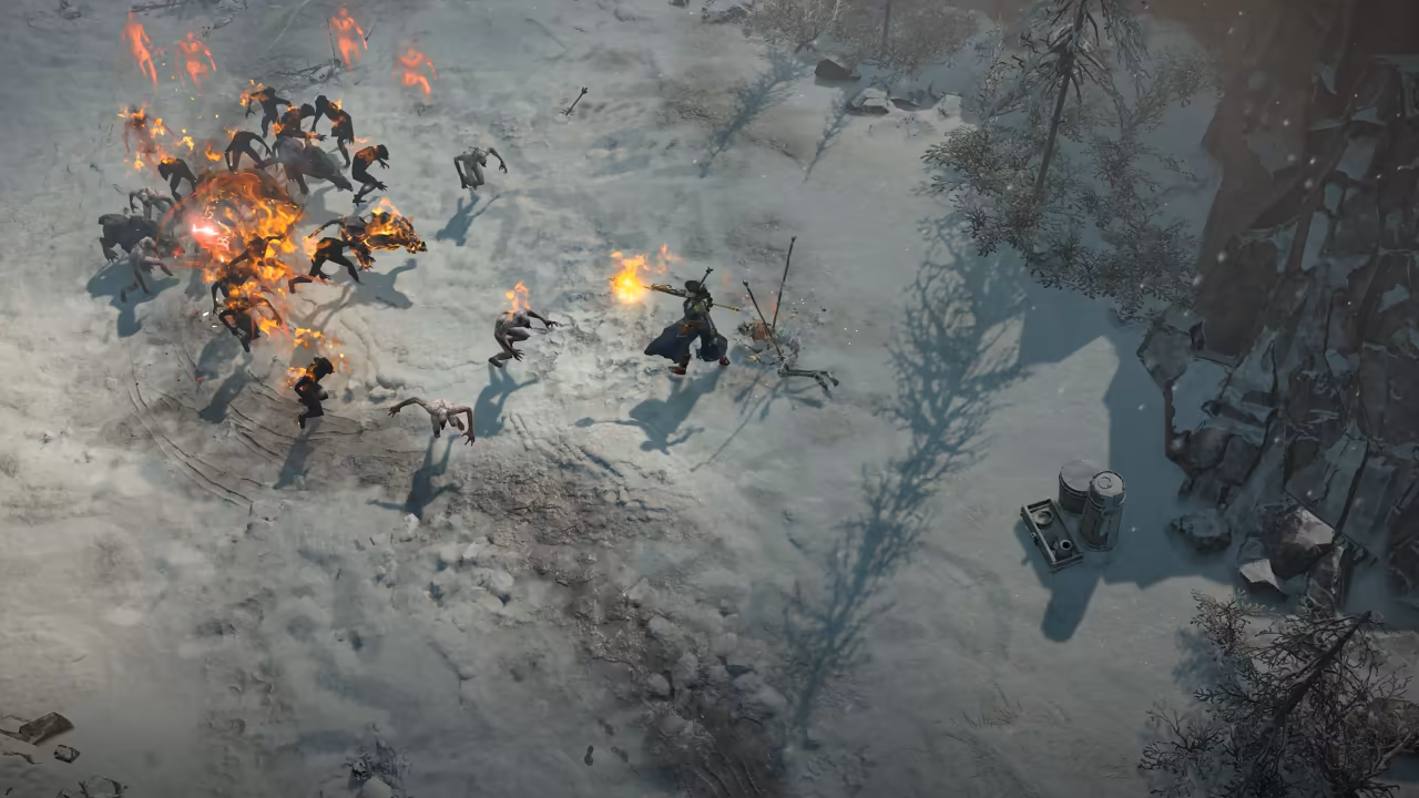 A snowy hillside seen from above. A robed figure with a staff fires a burning ball at a crowd of gray, hunched creatures, several of them on fire; a few barrels stand near rocks at lower right.