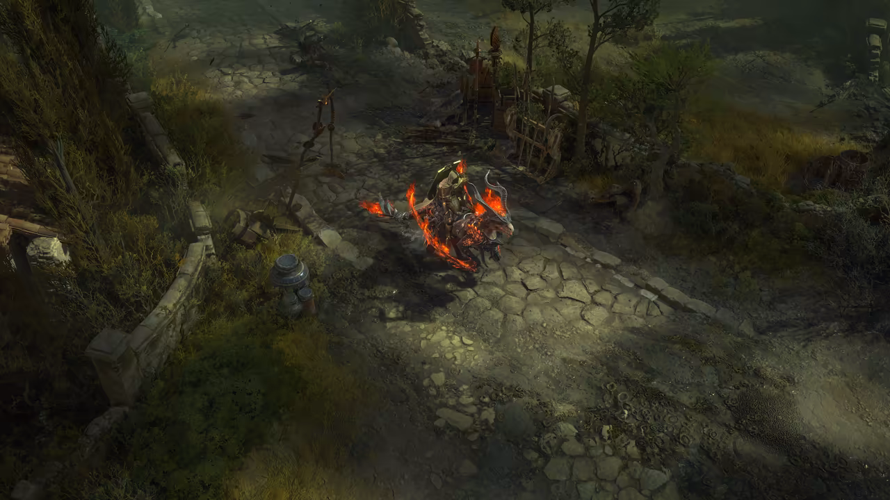 Top-down view of a gray cobbled road with a low stone wall and trees. A rider in white and gold sits on a reptile with red scales and flickering flames along its body.