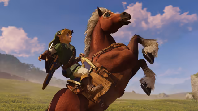 Seen from below, a young man in a green tunic and cap with a blue shield on his back sits on a rearing chestnut horse with a white mane, a leather saddle and harness, its front hooves raised. A grassy plain and low hills stretch away under a blue sky with pink-tinged clouds.