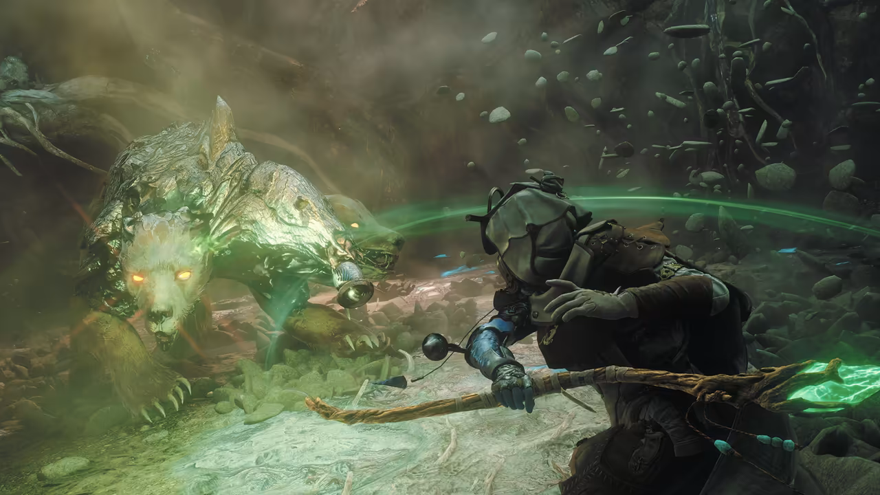 A misty underground cavern lit with green light, rocks hanging in the air. In the right foreground a fighter in a dark helmet and leather armor crouches and draws a long, gnarled wooden bow whose end shines bright green, a green arc of light curving across the scene. At left a massive pale bear with glowing yellow eyes and a hide like hammered metal charges forward, a second head with glowing eyes and a hanging bell visible behind its first. No game interface is shown.