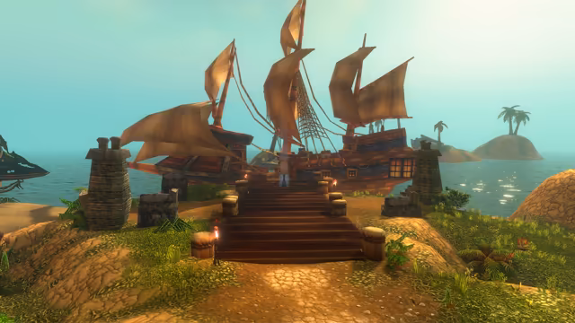 From a sandy, grassy path, a broad wooden stairway with torches and short rope-wrapped posts rises between two square stone pillars to the deck of a big sailing ship with tan sails and lit stern windows. A small figure stands at the top of the steps, and palm-topped islets and calm water lie beyond under a misty sky.