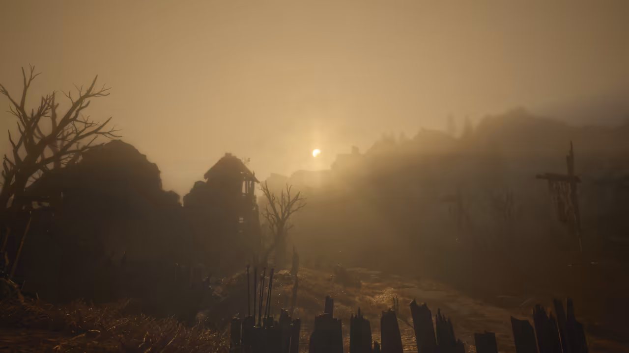 Thick amber fog almost hides a hillside. Silhouettes of broken, roofless houses stand at left beside a bare tree, the small bright sun shows through the haze at center, a tall wooden frame stands at right, and splintered fence posts and a rack of spears or poles fill the foreground. No game interface is shown.