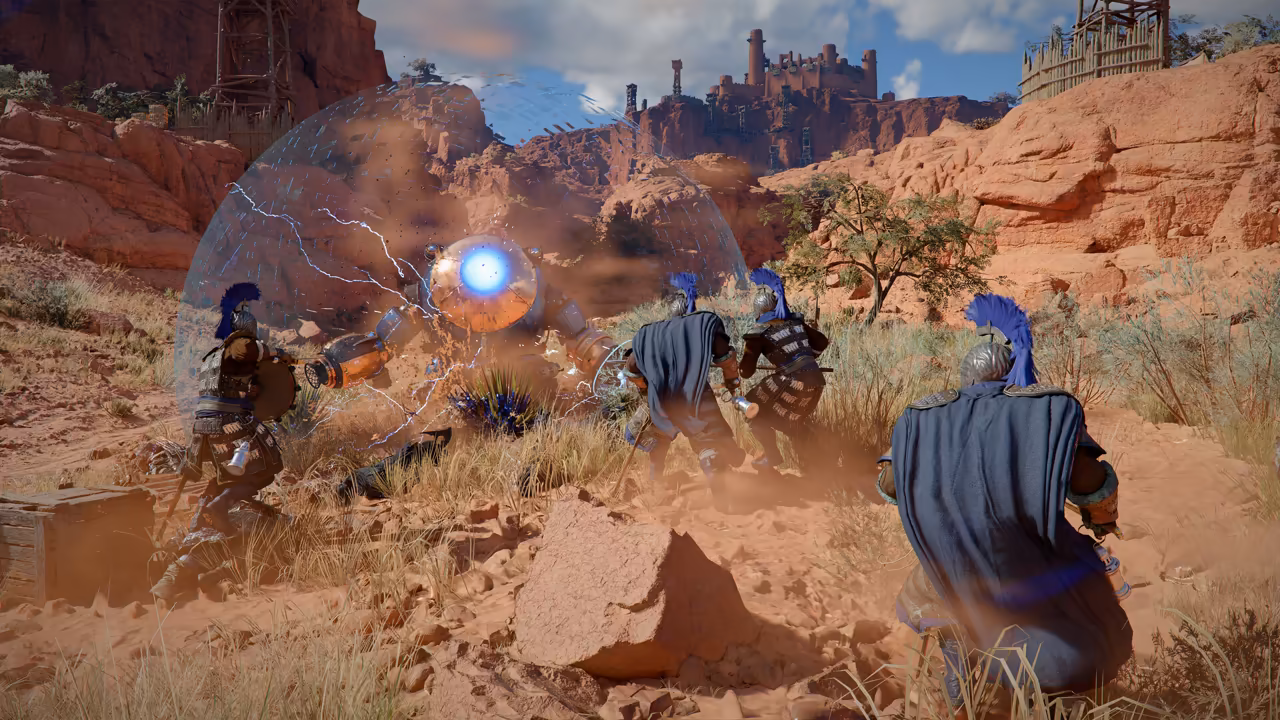 A sunlit canyon of red rock and dry grass. Several soldiers in steel armor, blue capes and helmets with tall blue crests move toward the center, where a bright blue sphere hangs inside a large transparent dome laced with lightning. A walled fortress and wooden scaffolding stand on the cliffs above.