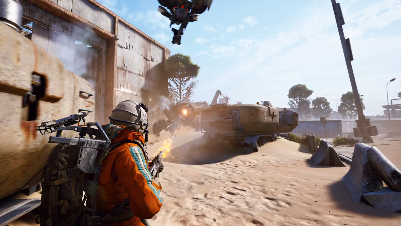 A Raider at left aims from behind a concrete block; a bulky machine fires back with muzzle flashes across sand and rubble; a small drone hangs overhead.