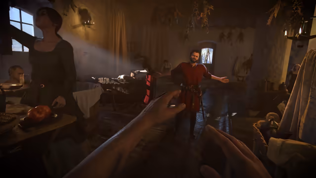 A dim tavern room with herbs hanging from the beams and sunlight from a window; a hand reaches in from the bottom of the frame toward a smiling bearded man in red with open arms, beside a woman in a dark dress at a table.