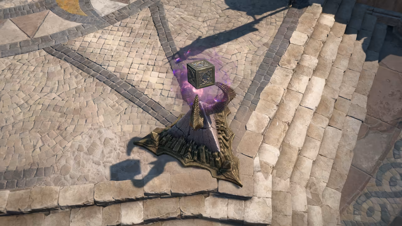 Top-down view of pale paving stones and a stairway. A small ornate metal cube hovers in a purple glow above a pointed, tiered bronze base.