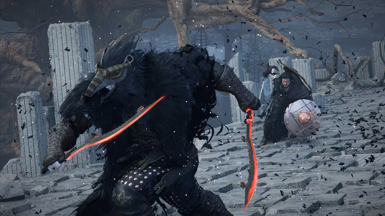 In a gray, ruined stone courtyard with broken columns and a bare tree, a towering figure covered in shaggy black feathers, wearing a long beaked mask, holds two curved blades that glow red. Facing him, a man with a beard and a round shield raises his sword. Black feathers swirl through the air.