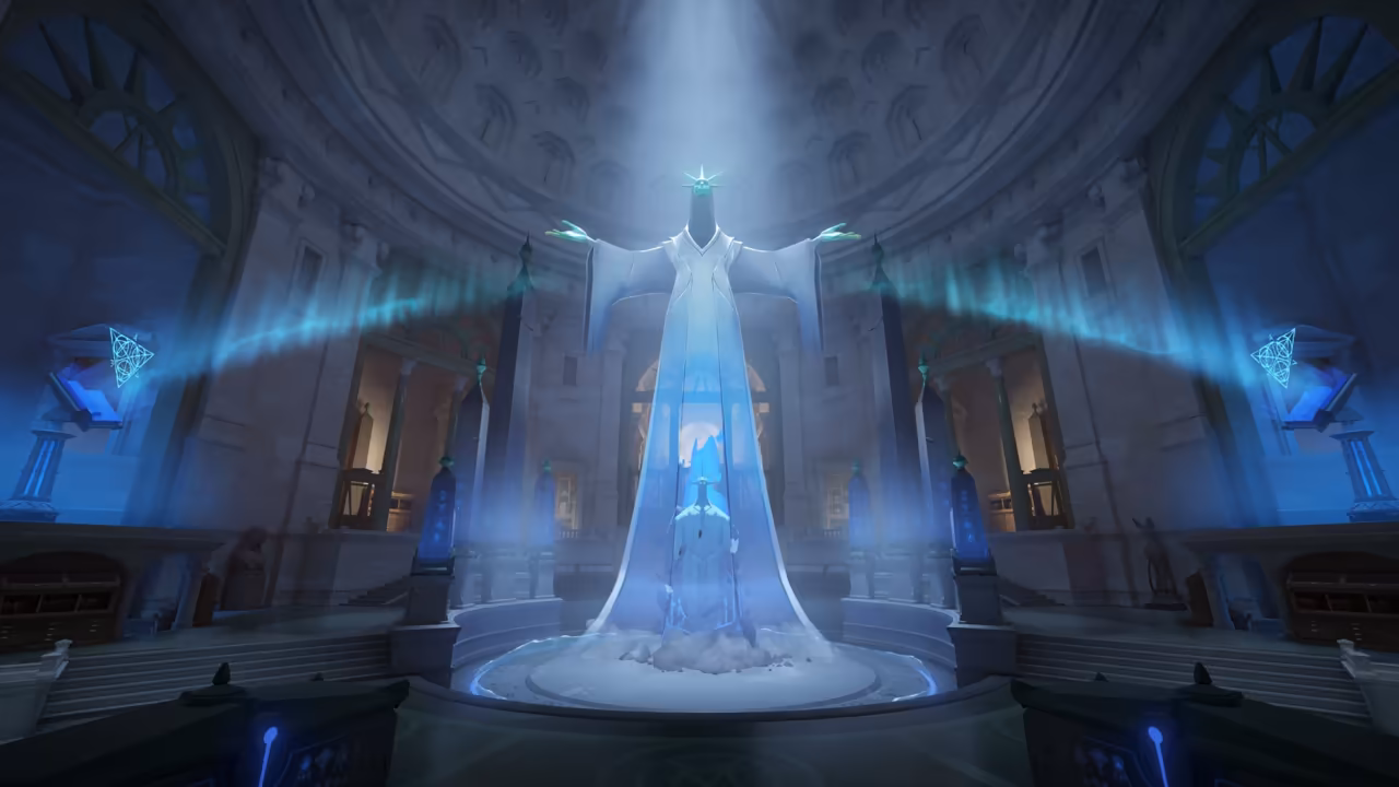 A circular hall with a coffered dome and arched windows, bathed in blue light; at its center a giant white robed figure spreads its arms above a glowing crystal on a round base, with blue banners of light streaming to the sides.