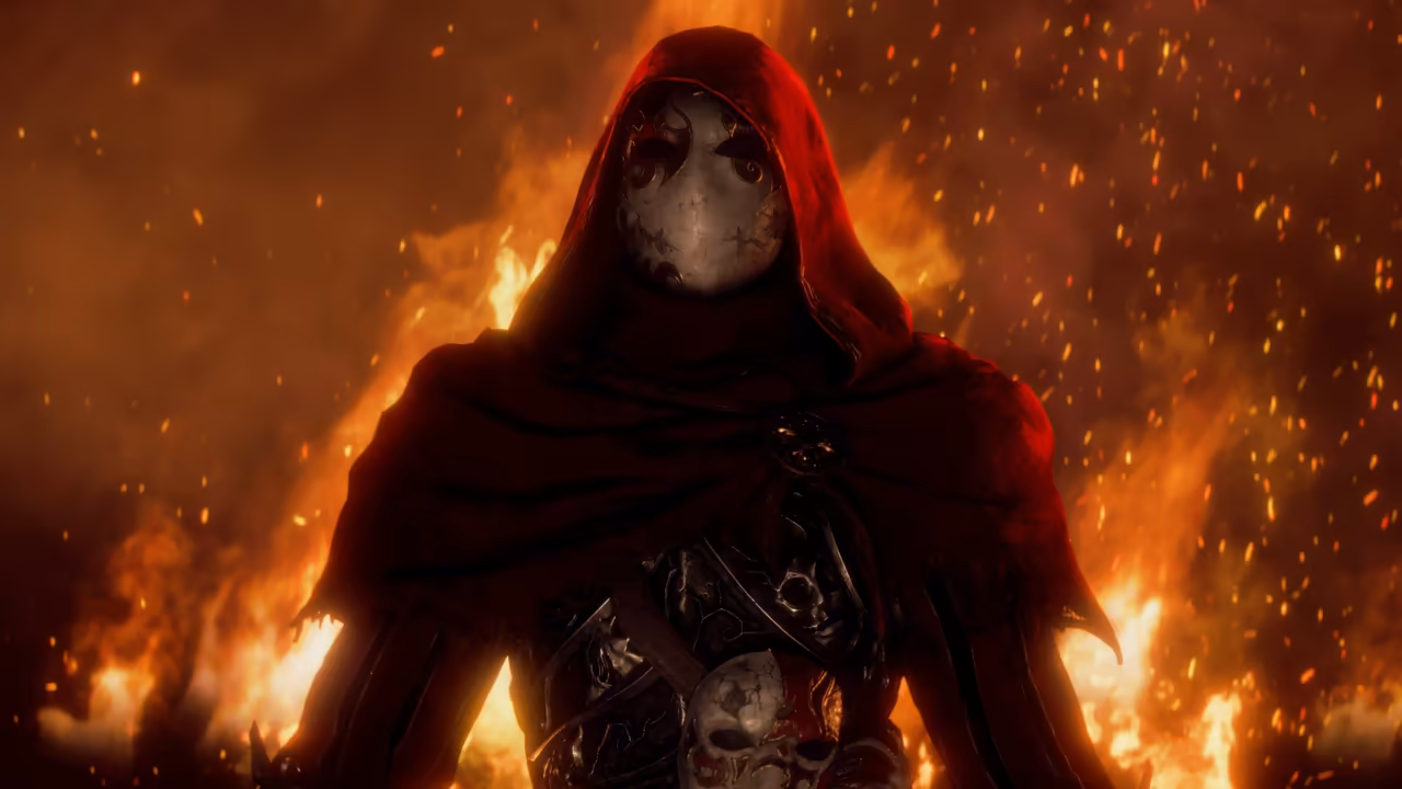 Close view of a figure in a heavy red hooded cloak whose face is hidden by a smooth white mask with cracks and painted dark swirls around the eye holes. The chest is covered in dark ornate armor bearing smaller masks, one white with red markings. Behind, flames fill the frame and sparks drift in the air. No game interface is shown.