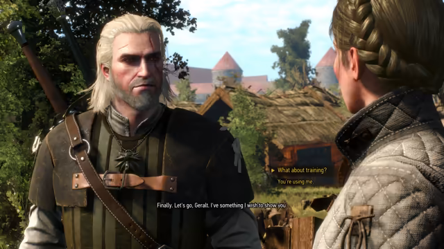 A white-haired, bearded man with a scar over his eye and a wolf medallion on his doublet faces a young woman seen from behind with a braided crown of hair and a quilted jacket. A subtitle has her ask Geralt to come and see something she wishes to show him, and the dialogue choices What about training and You're using me appear to the right, with thatched roofs and red-roofed towers behind.