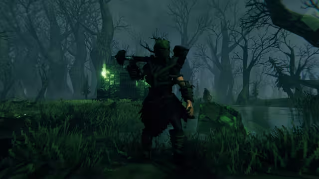 In-game screenshot of a Viking in dark armor bound with twisting roots, a mask topped with branches and an iron sledgehammer on the shoulder, standing in a foggy swamp near a stone crypt gate lit by green flames, with a draugr and a glowing green blob behind.
