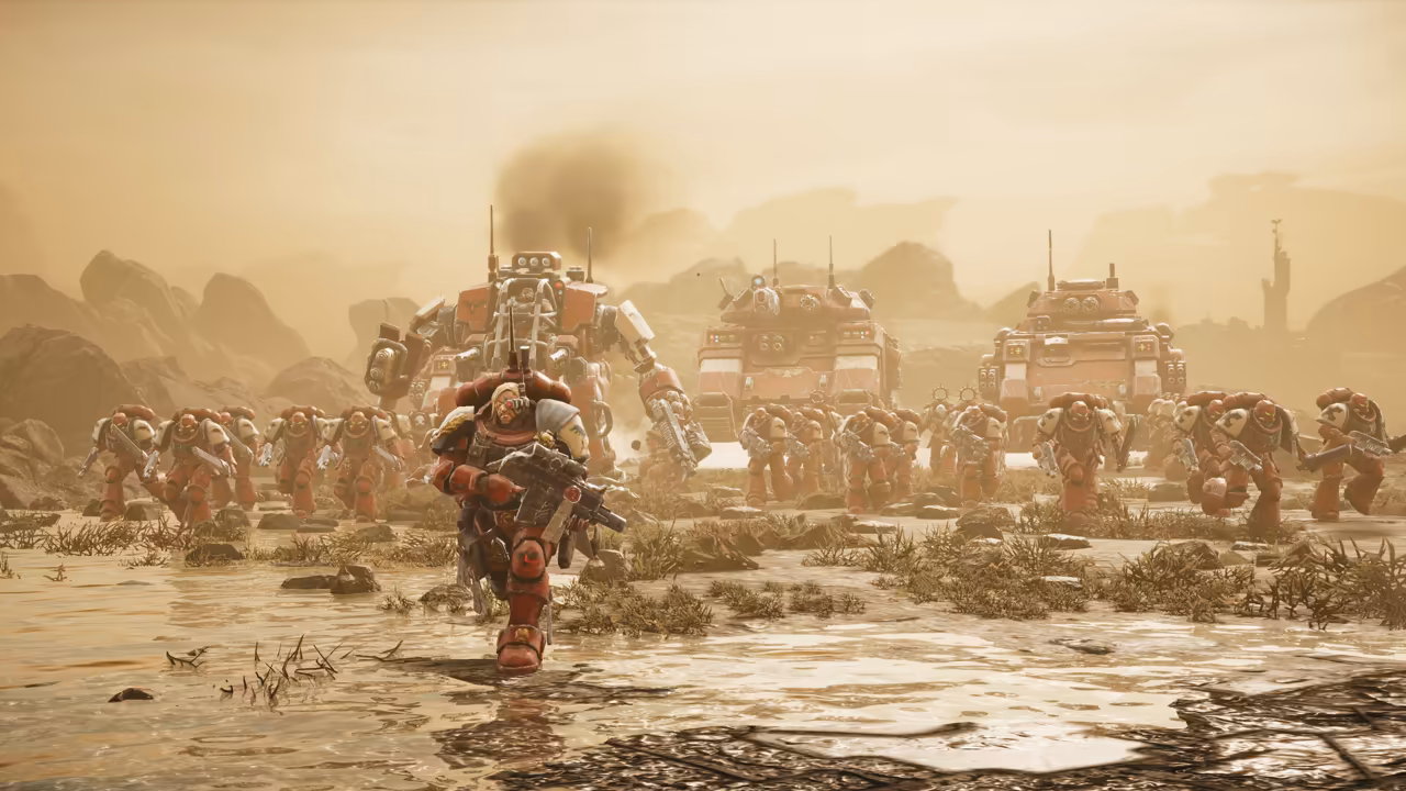 A golden, dusty plain with shallow water; a Blood Ravens squad and a large walker advance, with tanks behind under a hazy sky.