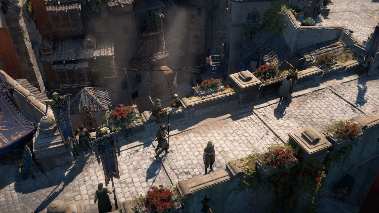 Top-down view of a stone bridge and plaza between tall houses with tile roofs. Window boxes overflow with red flowers; people in robes walk past, guards hold spears and two blue banners with golden figures hang on poles.