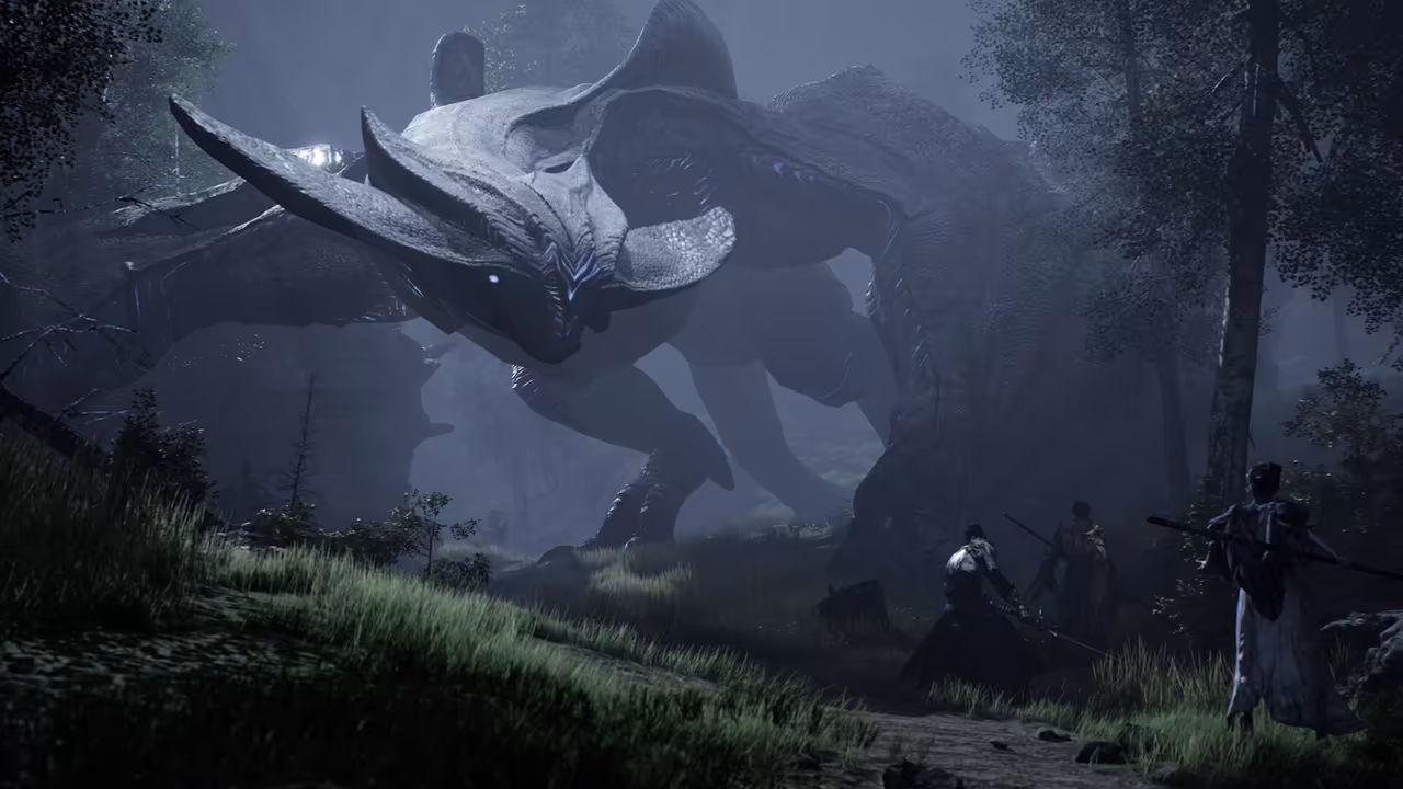 A dark forest at night under blue mist. On a grassy path at lower right three armed figures face away from the viewer: one in a long coat holds a spear across his shoulders, another in light armor stands beside him, and a third waits behind. Above them a colossal four-legged creature with a huge flat horned head, thick gray hide and one pale glowing eye fills most of the image, its body bigger than the trees around it. Tall grass fills the foreground. No game interface is shown.