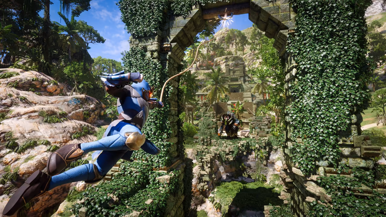 Bright jungle daylight. In the foreground a figure in blue and brown armor flies through the air, legs swung forward, holding a rope that runs up to a glowing hook point at the top of a tall stone arch covered in green ivy. Through the arch a stepped temple ruin rises among palm trees, and a dark hulking creature stands among the ruins below. No game interface is shown.