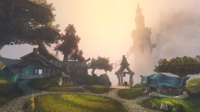 Cobbled paths lead across a grassy hilltop past houses with curling blue roofs and trees with red and green leaves to a pointed wooden gateway over a bridge, hung with blue and purple banners. A huge chain runs from the gateway up to a tall pale tower that fades into bright golden fog.