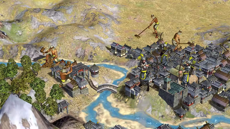 3D view of a city of gray roofs beside a winding blue river with an arched bridge, armored figures in the streets, and laborers swinging tools on the brown hills and by small buildings at left.