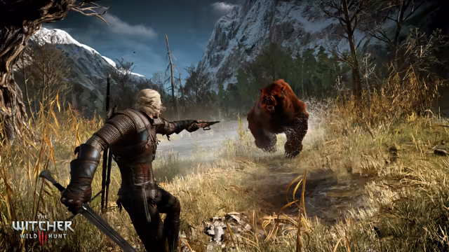 A white-haired man in armor with a sword in his lowered right hand points a hand crossbow with his left at a large brown bear splashing toward him across shallow water. Bare trees, golden grass and snowy cliffs frame the scene, and The Witcher Wild Hunt logo sits at lower left.
