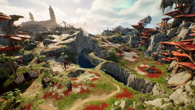 High view over green and gray rocky highlands scattered with red flowers; huge trees with flat red caps stand on both sides, a dirt path winds past a small figure toward a canyon holding a dark blue pool, and pale stone spires and ruins rise on distant cliffs under a bright, cloudy sky.