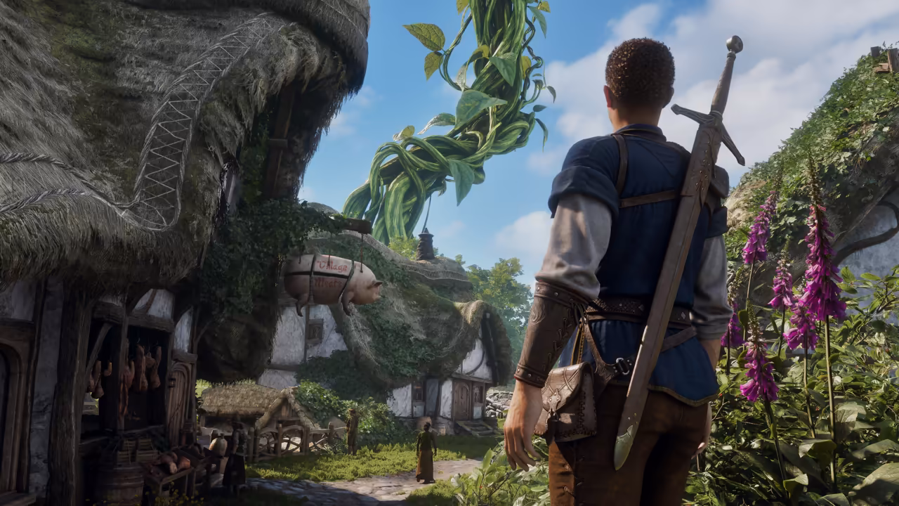Sunny day. At right a man in a blue tunic, seen from behind, with a long sword across his back and a leather pouch at the belt, stands among tall purple foxgloves. To the left, cottages with thick, overgrown thatched roofs; a sign shaped like a pig hangs from one, painted with the words Village Meats, above a stall of hanging meat. Beyond the roofs an enormous green beanstalk twists up into the blue sky. No game interface is shown.