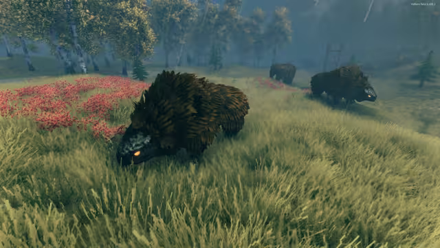 Three shaggy brown beasts with dark scaly heads and glowing orange eyes graze on a grassy hillside dotted with red flowers, birch trees and small firs behind them
