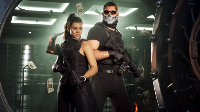 A woman and a man in black body armor and gloves hold rifles in front of a massive round vault door, the man in sunglasses and a skull face mask, as money and burning bills float through the green-lit vault.