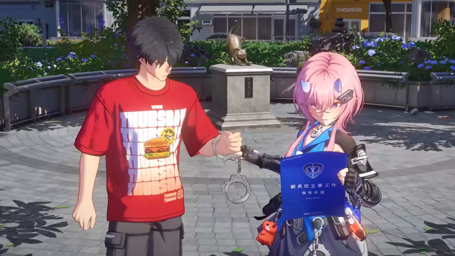 In a paved plaza with hydrangea beds and a stone plinth topped by a bronze cat, a black-haired young man in a red THURSDAY burger T-shirt has a handcuff on his wrist, while a pink-haired girl with small purple horns, a blue uniform and black gloves holds the other cuff and a blue booklet with a shield emblem, a Chinese title and the letters NCCA. A yellow shop sign reading CHOWSOO is behind them, and no game interface is shown.