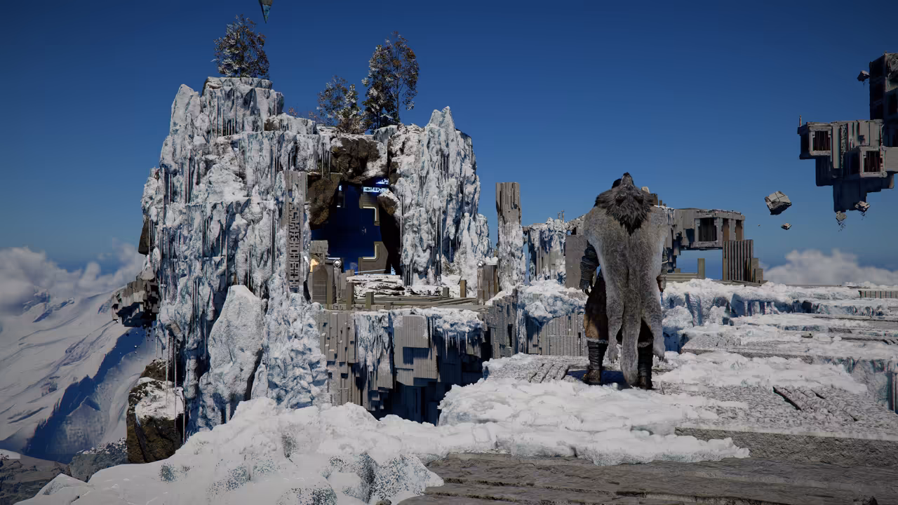 Seen from behind, a figure wrapped in a thick gray fur cloak stands on snowy ground. Ahead rises a craggy outcrop coated in ice, built into blocky stone ruins with a doorway lit blue inside. Blocks and fragments of stone float in the clear blue sky at right.
