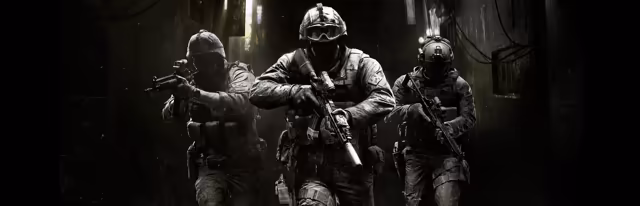 A dark, grainy alley lit by a few lamps: three helmeted soldiers in body armor walk forward with rifles raised, the middle one wearing goggles.