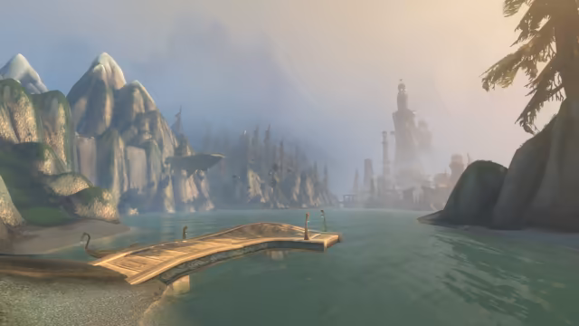A curved wooden pier with swirl-patterned sides and lamp posts reaches out over calm green water from a sandy shore. Steep mossy cliffs with waterfalls and pines stand on the left with small boulders apparently hanging in the air beside them, and a city of pale towers and domes rises in the haze ahead.