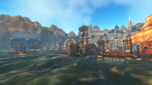 From low on the water, dark green waves roll toward wooden piers and a moored ship whose prow is carved as a great bird's head, with another ship's orange sails at the right edge. Beyond the docks, a pale stone city of battlements and towers climbs toward a tall white spire, beside a blue-roofed dock building and brown hills under a blue sky.